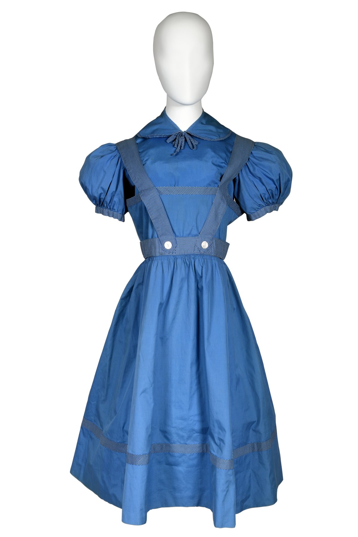 Early Dorothy dress from "The Wizard of Oz," worn by Judy Garland as "Dorothy" - Qatar Museums Early Dorothy dress from "The Wizard of Oz," worn by Judy Garland as "Dorothy" - Qatar Museums